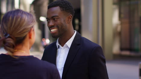 Businessman-And-Businesswoman-Shaking-Hands-Outside-Offices-In-The-Financial-District-Of-The-City-Of-London-UK-2