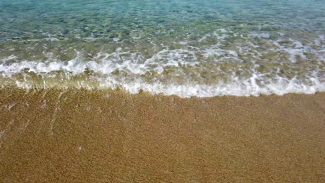 Static-Shot-Of-Crystal-Clear-Waves-Crashing-On-The-Shoreline