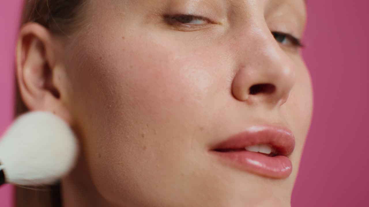Woman Applying Blush Makeup