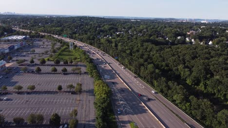 a highway next to a mostly empty shopping center in braintree, massachusetts