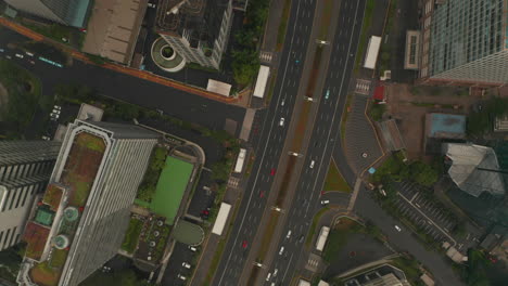 Aerial-Birds-Eye-Overhead-Top-Down-View-of-multi-lane-city-traffic-on-a-cloudy-day