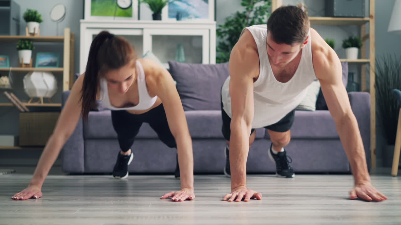 Couple Doing Push-ups at Home