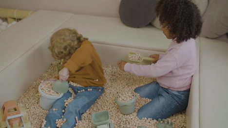 little kids with wooden cubes