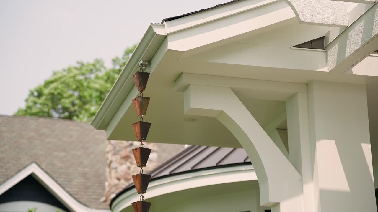 Rain chain hanging off home's side