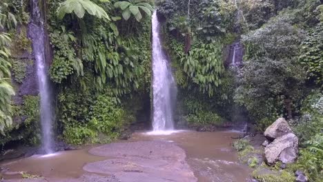 lonely blonde girl walking to waterfall