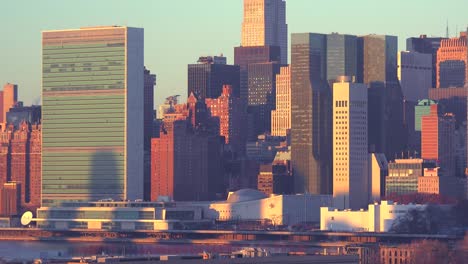 early morning shot of the new york city manhattan skyline with the united nations building in the foreground 1