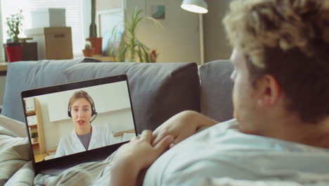 ill man having online consultation with doctor on video call