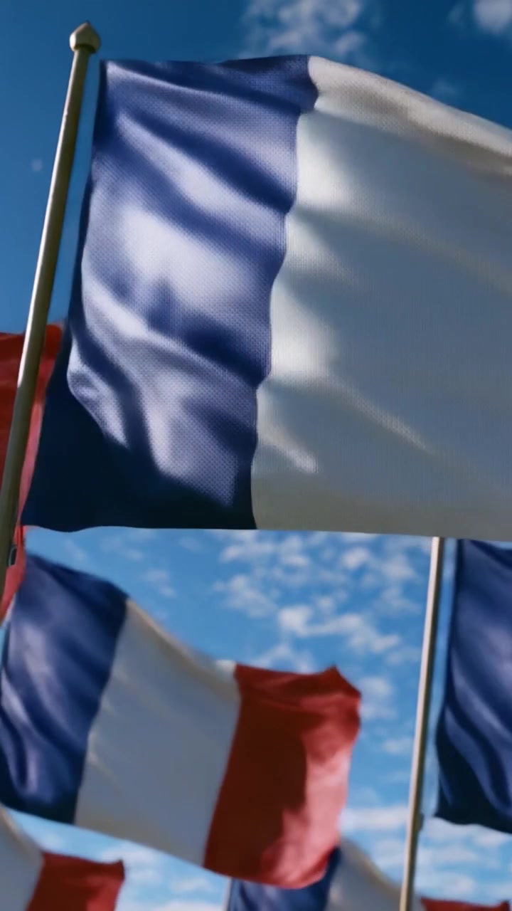 A Waving Display of Flags: Captivating Captures of French Flags Fluttering Against a Beautiful Blue Sky, Reflecting National Pride and Cultural Significance