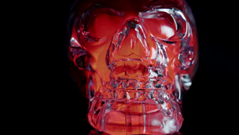 Slow-pull-back-shot-of-Red-Crystal-Cranium-on-black-studio-background