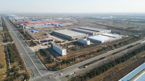 an aerial perspective captures a factory situated on the industrial outskirts of shandong province, linyi, china