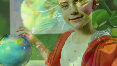 Animation-of-leaves-over-caucasian-schoolgirl-looking-at-globe