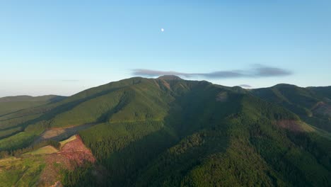 moon above iconic pico da vara mountain covered in greenery, sao miguel