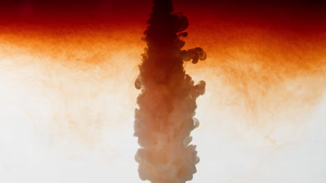 slowmotion gush of orange ink dye into water, 240fps smoke fume visual