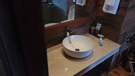 elegant wash basin inside the bathroom of an luxurious hotel suite - zoom-out