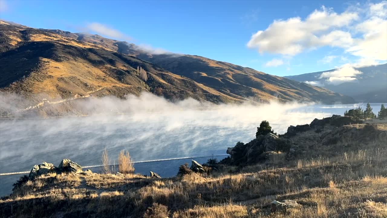 Steam wafting off Lake Dunstan near the Clyde Dam on a frosty morning