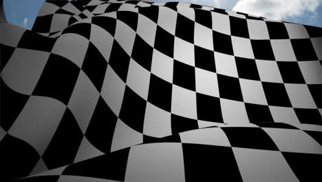 checkered flag waving against blue sky