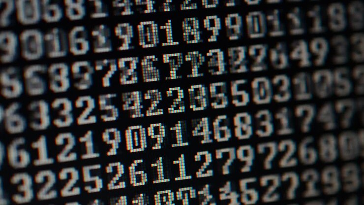 Binary code on the monitor screen. Shooting of a binary code, background