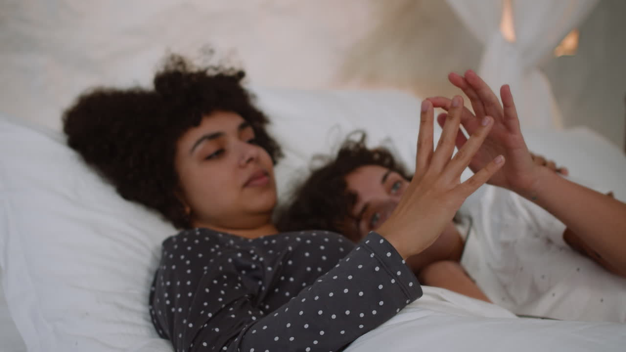 Happy couple laying on bed