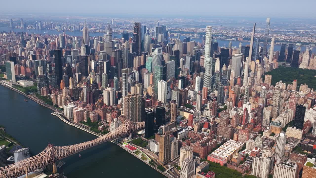 Panoramic drone shot overlooking the Midtown East and Lenox Hill, in sunny NYC