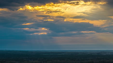 time lapse of sunset clouds, golden hour sun rays shine with hope over countryside fields