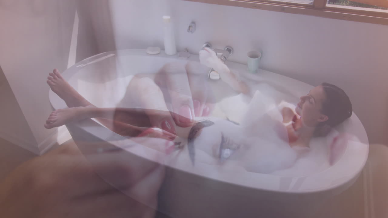 Applying nail polish, woman relaxing in bathtub with animation overlay of hands