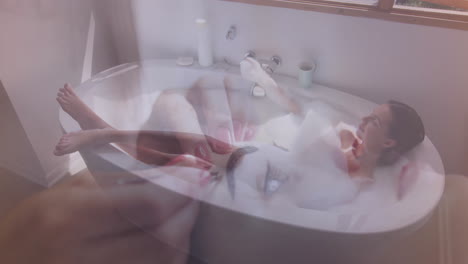 applying nail polish, woman relaxing in bathtub with animation overlay of hands