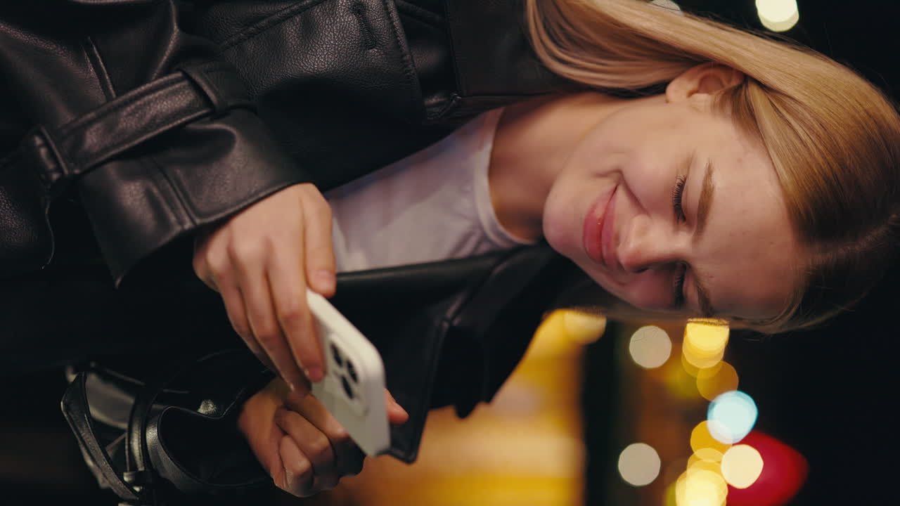 Woman with phone at night