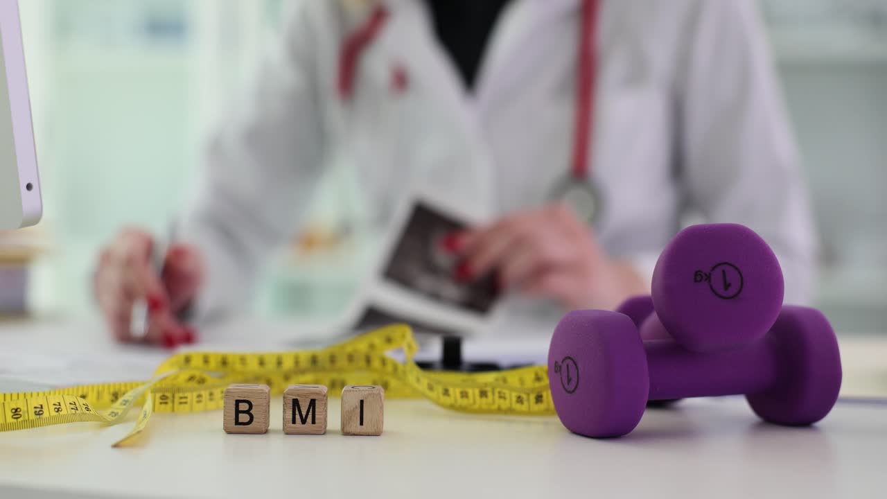 Medical professional discussing health and fitness with BMI concept
