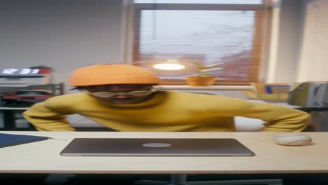 man working on laptop in home office