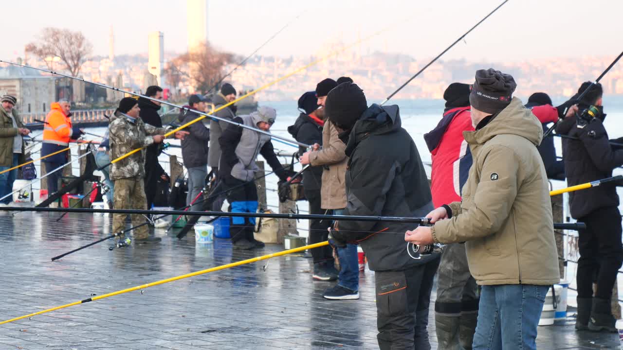 People fishing on a pier in Istanbul, Turkey