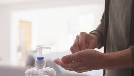 woman in self isolation in quarantine during coronavirus pandemic washing he r hands