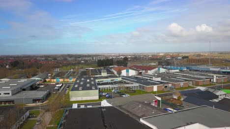 the historical city of middelburg with in the foreground a canal and industrial area