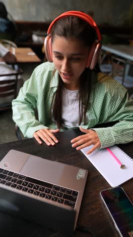 woman studying in a cafe