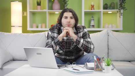 Thoughtful-young-man-looking-at-camera.