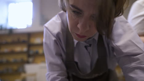 woman working on pottery