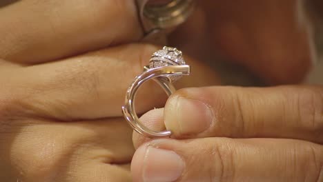 italian goldsmith at work building an engagement or a wedding ring