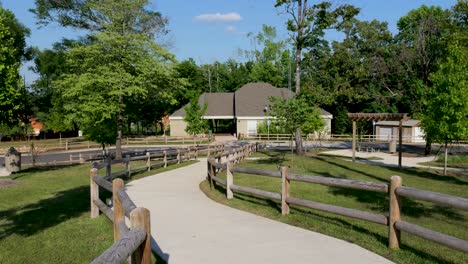 Winding-sidewalk-path-to-buildings-at-Providence-Canyon-State-Park-sign-in-Lumpkin-Georgia-on-bright-sunny-day