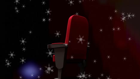 Animation-Von-Schnee,-Der-über-Einen-Einzelnen-Roten-Kinosessel-Fällt
