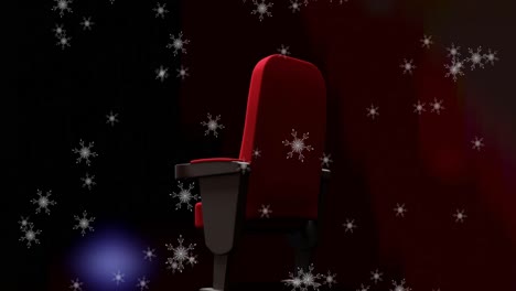animación de la nieve cayendo sobre una sola sala de cine roja