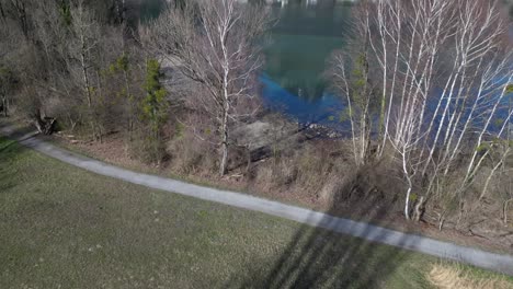 panning up drone clip moving towards lake walen in swiss alps