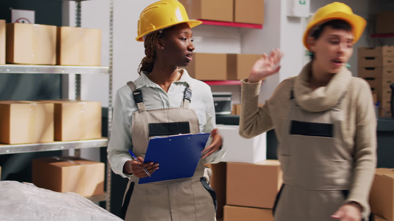 Warehouse workers discussing inventory with boxes and checklists