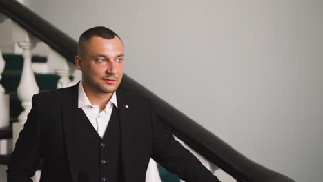 Gentleman-in-classic-suit-with-vest-and-shirt-on-staircase