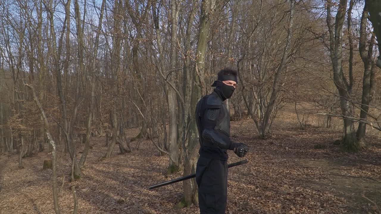 A ninja dressed in black stealth gear moves through a misty forest, gripping his sword. Perfect for action-packed content, martial arts visuals, and cinematic storytelling.