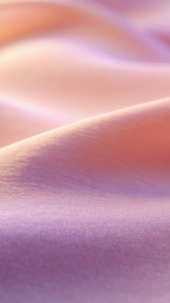 Vertical video: Gliding silk fabric shifting with soft light moving in closeup, revealing ridge