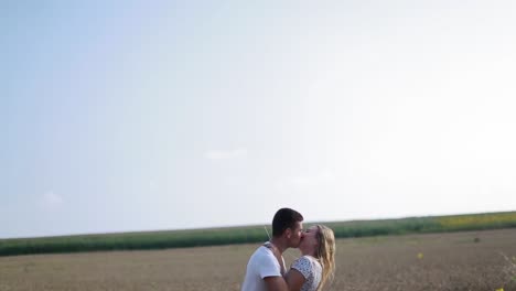 lovely couple play air kite. pretty girl and young man having fun outdoors