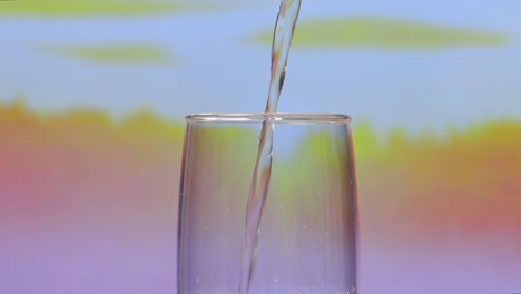 pouring water into a glass