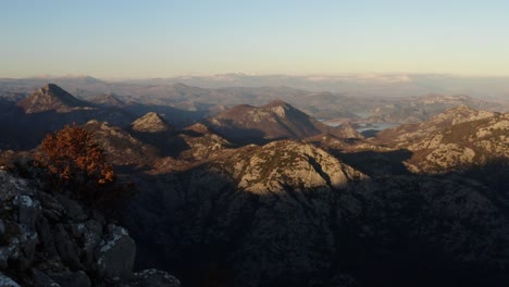 aerial - mountains and valley around lake skadar, montenegro, wide reverse shot