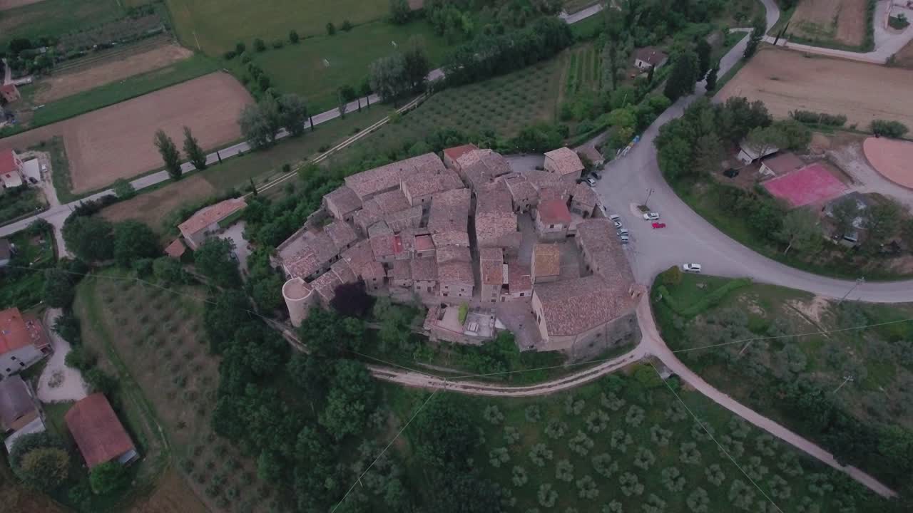 Aerial Drone shot Fly Over and Tilt Down onto Medieval Italian Village in Umbria, Italy