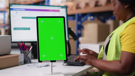 vertical video employee reviews copy space monitor in the storage room for data entry