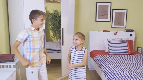 The-two-children-are-jumping-around-the-room-and-they-are-happy.